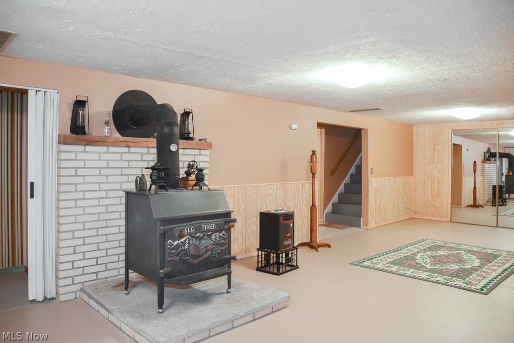 6094 Hanna Road Ravenna, OH 44266 - Photo 16 of 31 Rec room with a wood burner.