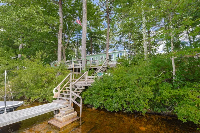 a view of a house with a yard from a balcony