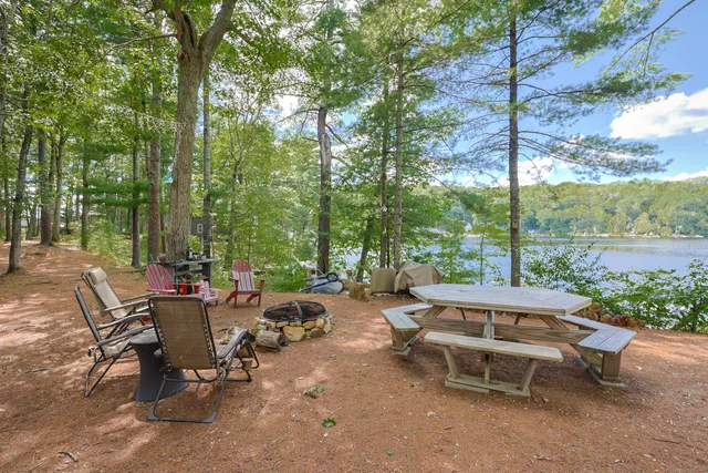 a view of a backyard with sitting area