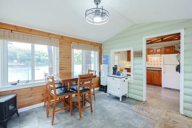 a very nice looking dining room with a large window