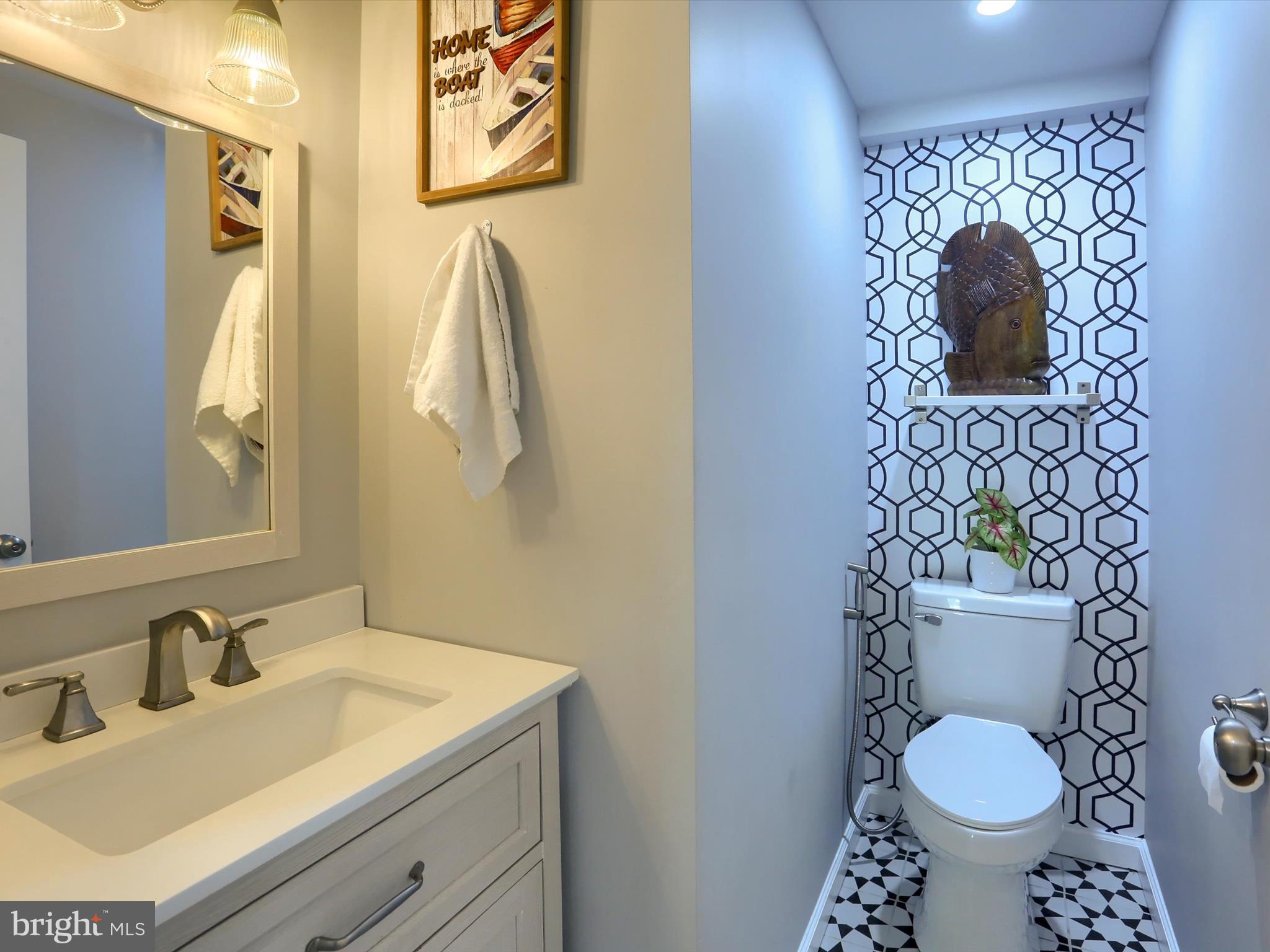 5931 York Road Spring Grove, PA 17362 - Photo 11 of 38 a bathroom with a toilet sink vanity and mirror