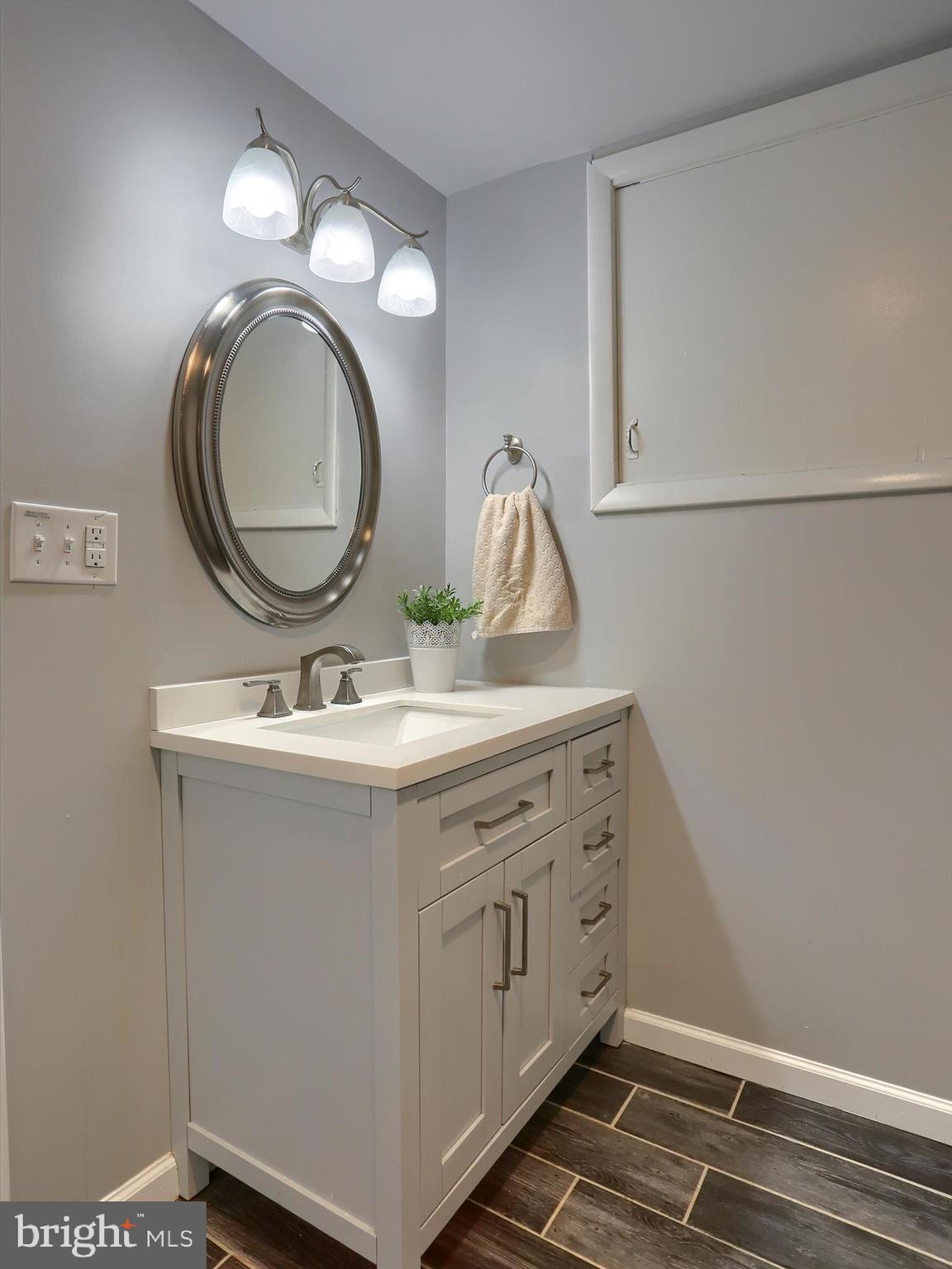 5931 York Road Spring Grove, PA 17362 - Photo 17 of 38 a bathroom with a sink vanity and a mirror