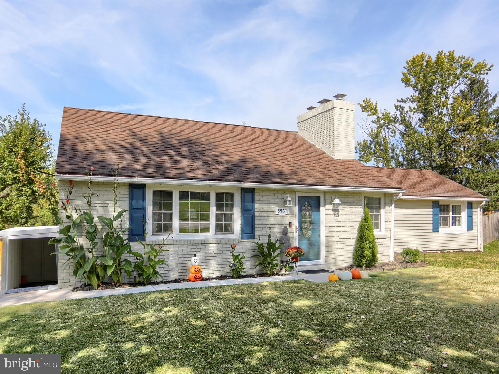 5931 York Road Spring Grove, PA 17362 - Photo 2 of 38 a front view of a house with a yard and potted plants
