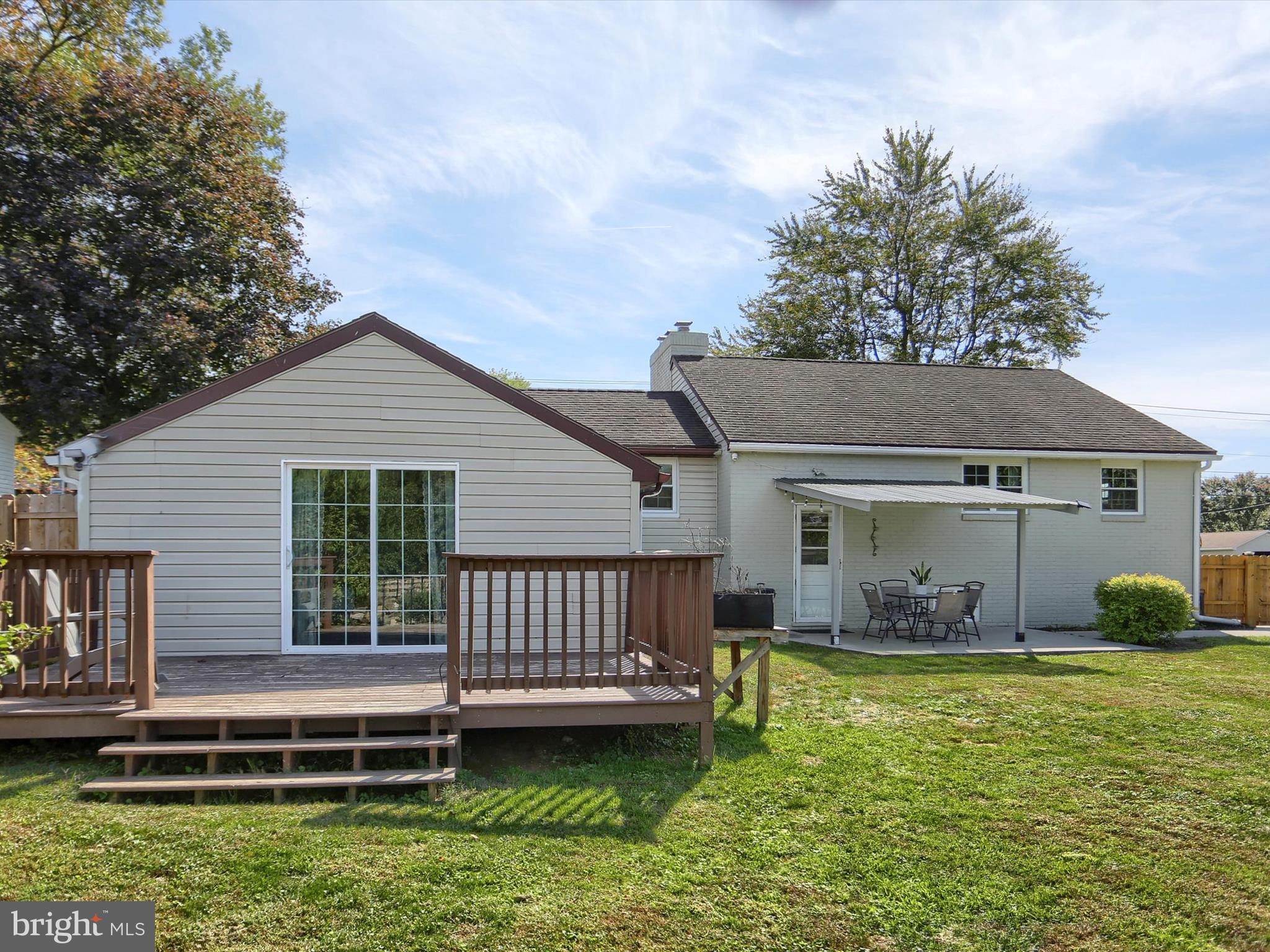 5931 York Road Spring Grove, PA 17362 - Photo 32 of 38 a front view of a house with a yard table and chairs