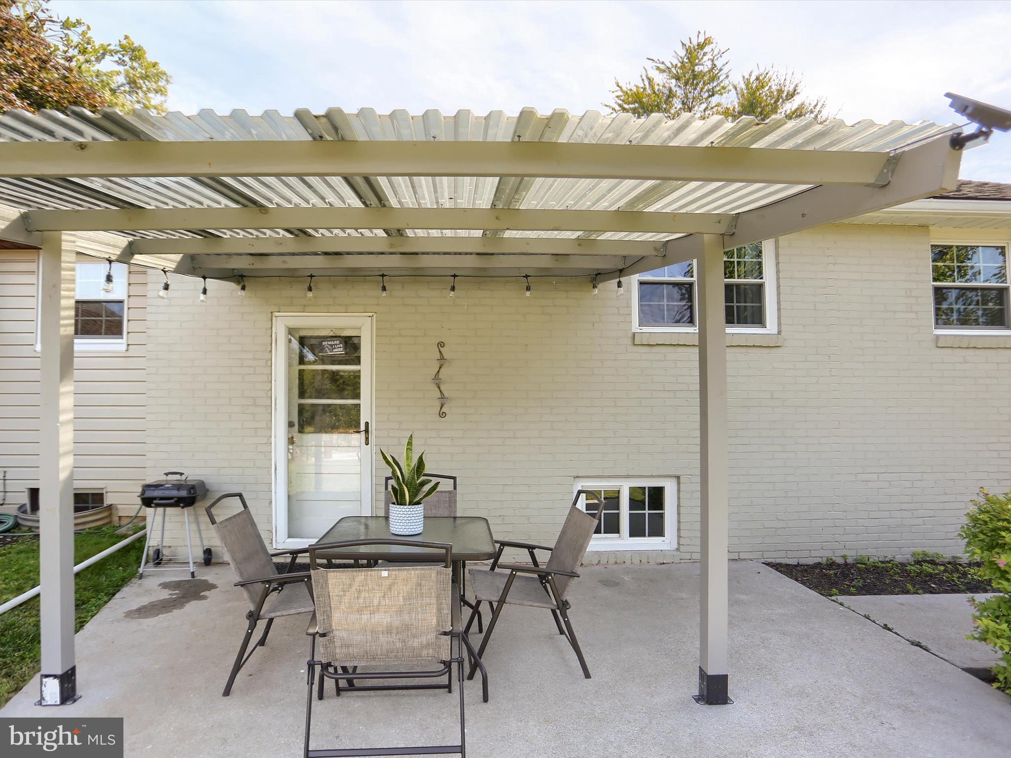 5931 York Road Spring Grove, PA 17362 - Photo 33 of 38 a view of a patio with table and chairs and potted plants