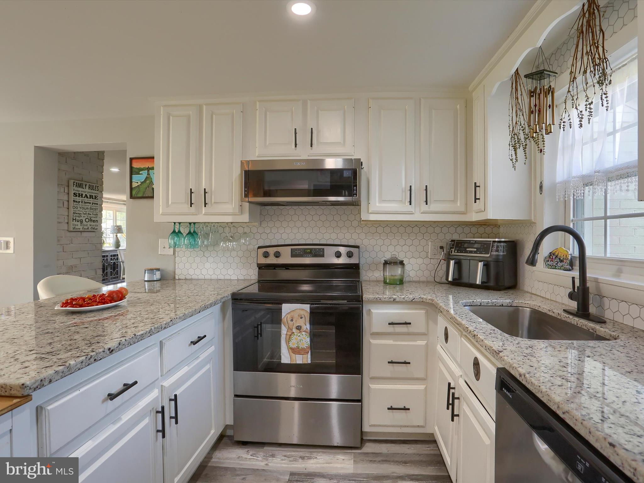 5931 York Road Spring Grove, PA 17362 - Photo 10 of 38 a kitchen with granite countertop a sink and cabinets
