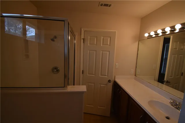 a bathroom with a sink and mirror