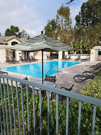 a view of a small yard with wooden fence