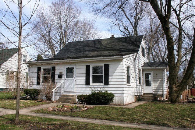 605 North 14th Street Rochelle, IL 61068 - Photo 1 of 12 a front view of a house with a yard