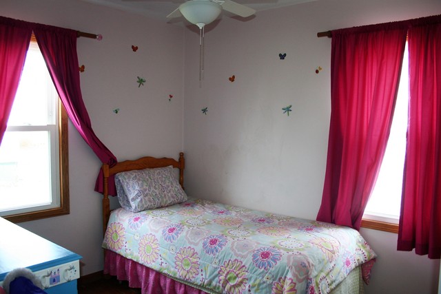 605 North 14th Street Rochelle, IL 61068 - Photo 8 of 12 a bedroom with a bed and a window