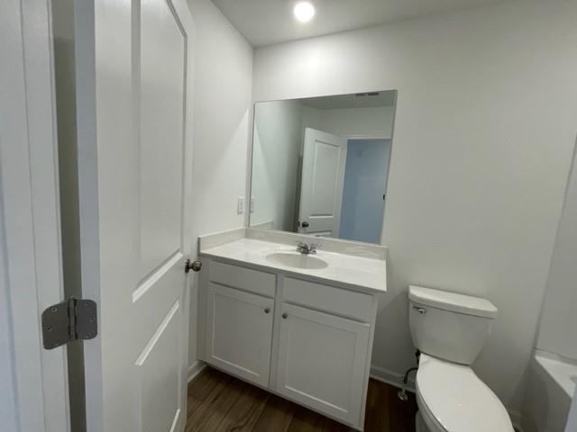 148 Vision Street Bethlehem, GA 30620 - Photo 7 of 8 a bathroom with a toilet a sink and mirror