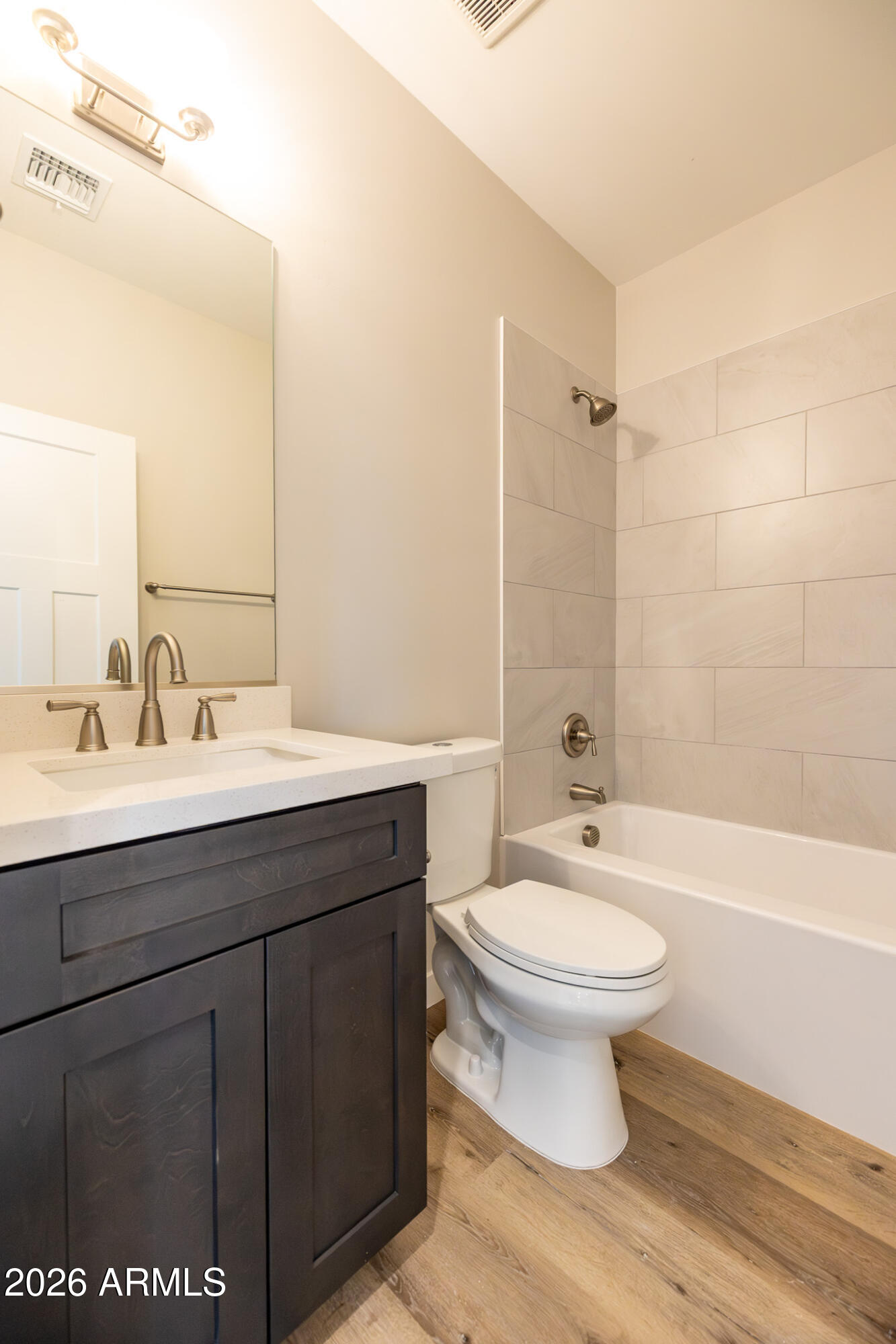 11459 East Adamsville Road Florence, AZ 85132 - Photo 22 of 63 a bathroom with a sink toilet a mirror and bathtub