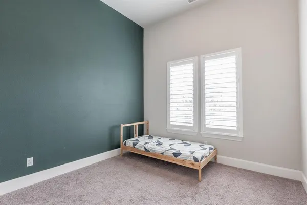 a room with a bed and a window