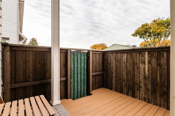 a view of a balcony with wooden floor