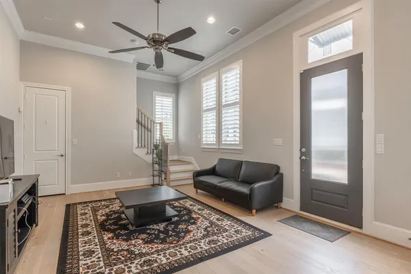 a living room with furniture and a rug