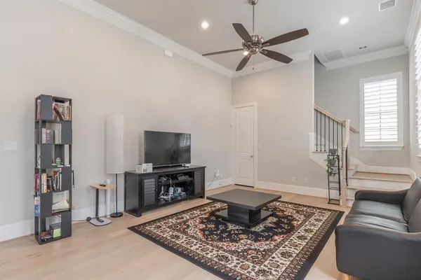 a living room with furniture and a rug