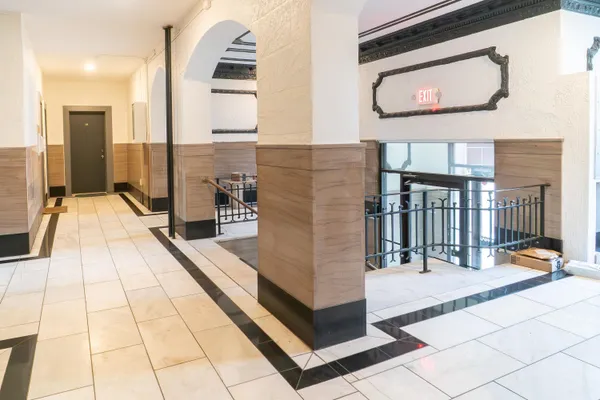 a lobby with glass door and glass door