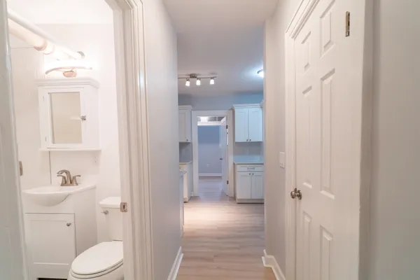 a bathroom with a toilet sink and shower