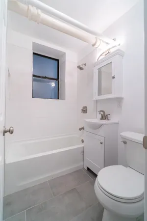 a bathroom with a toilet sink and bathtub