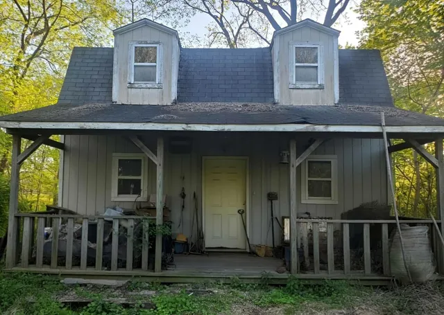 a front view of a house with yard