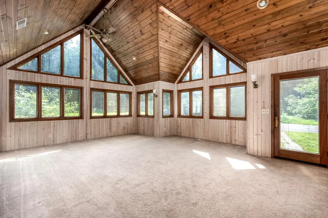 a view of an empty room with a balcony