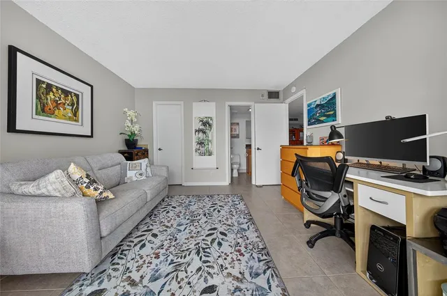 a living room with furniture window and a wooden floor