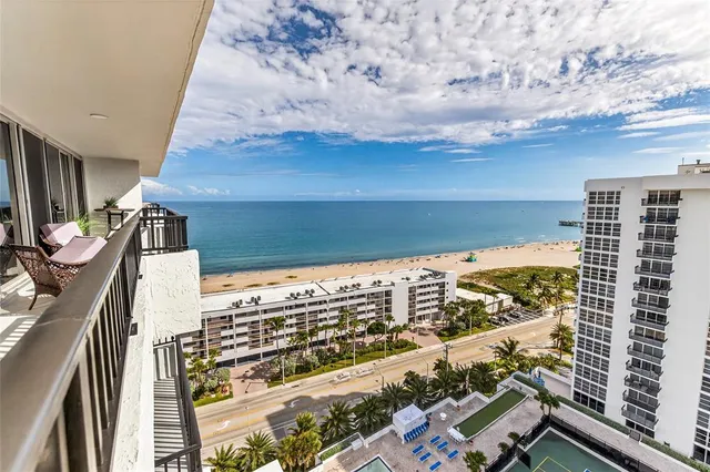 a view of a balcony with chairs