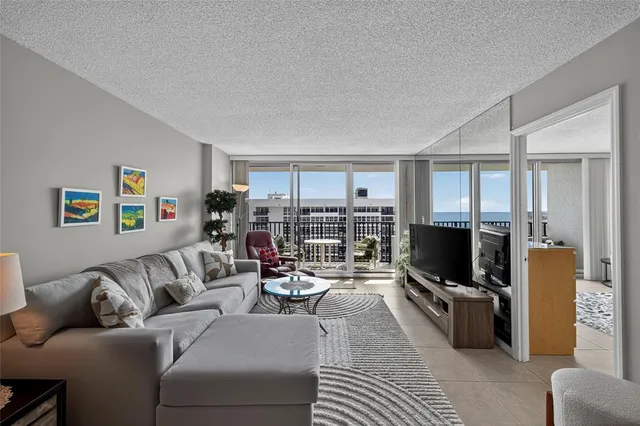 a living room with furniture and a large window