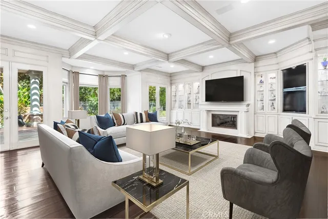 a living room with fireplace furniture and a flat screen tv