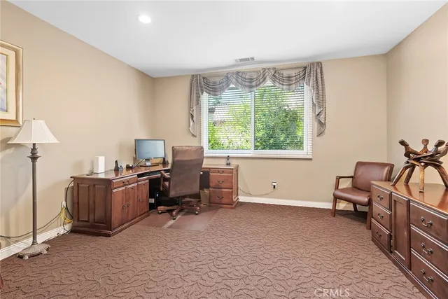 a view of workspace with furniture and a window