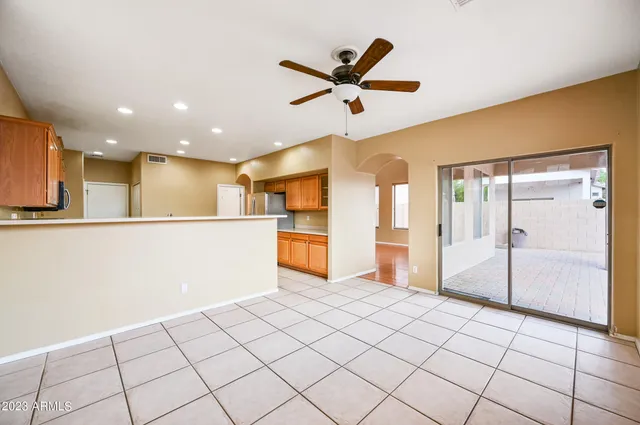 a view of a kitchen with a sink and refrigerator