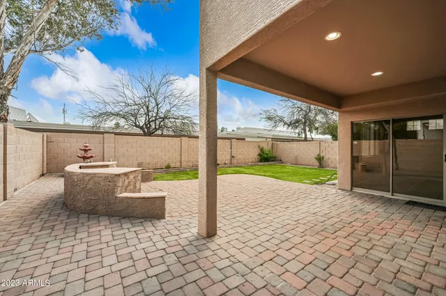 a view of white house with a sink and garden