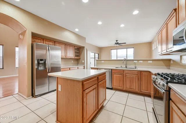 a kitchen with a sink stove and refrigerator