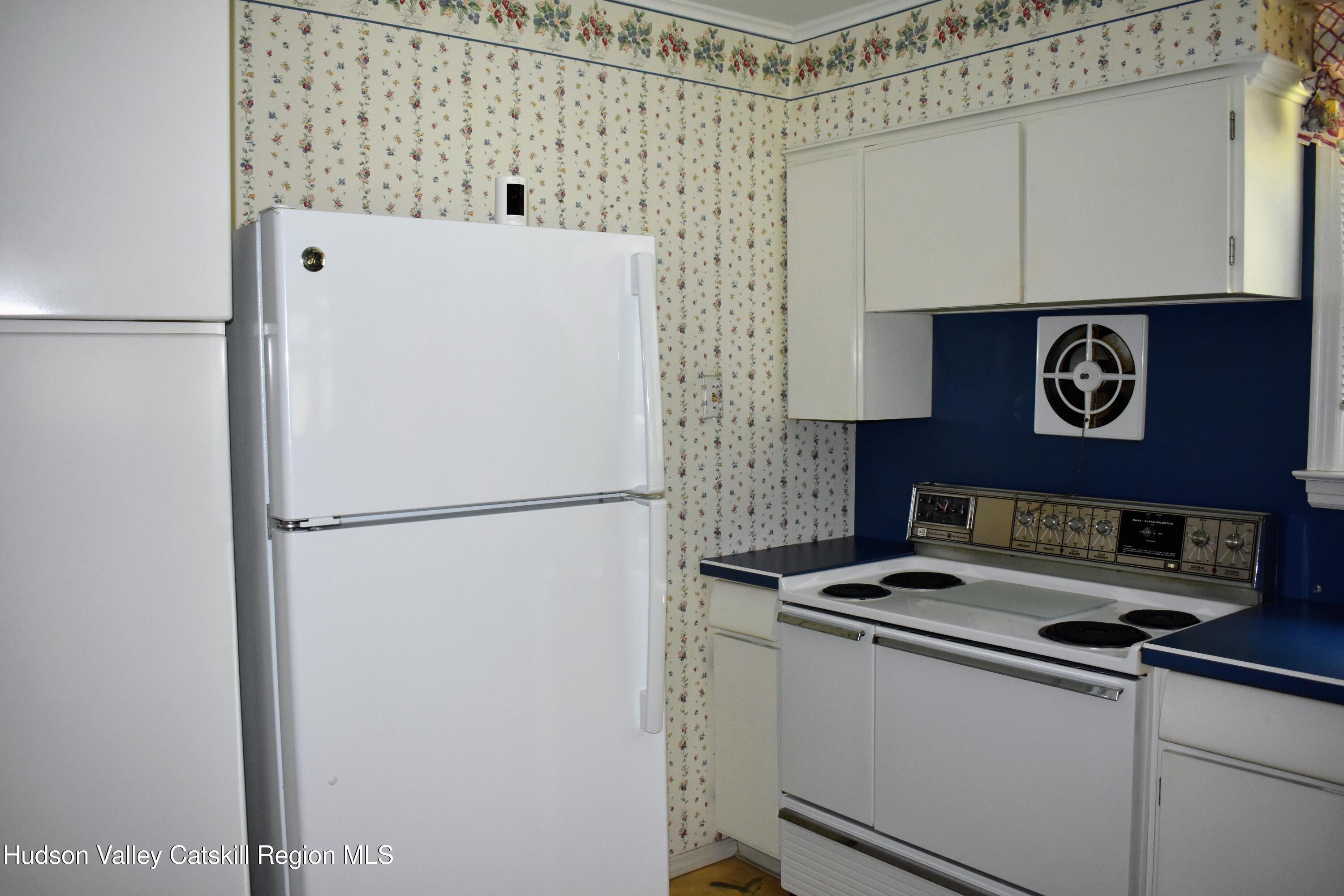 1254 Main Street Ruby, NY 12475 - Photo 5 of 29 a white refrigerator freezer sitting inside of a kitchen