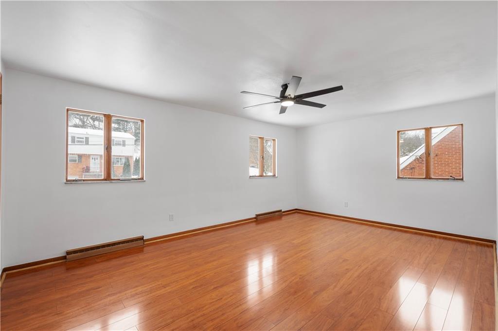 3930 Edge Road Pittsburgh, PA 15227 - Photo 21 of 45 a view of a room with wooden floor and a ceiling fan