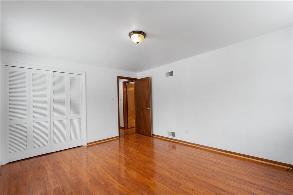 3930 Edge Road Pittsburgh, PA 15227 - Photo 22 of 45 a view of an empty room with wooden floor