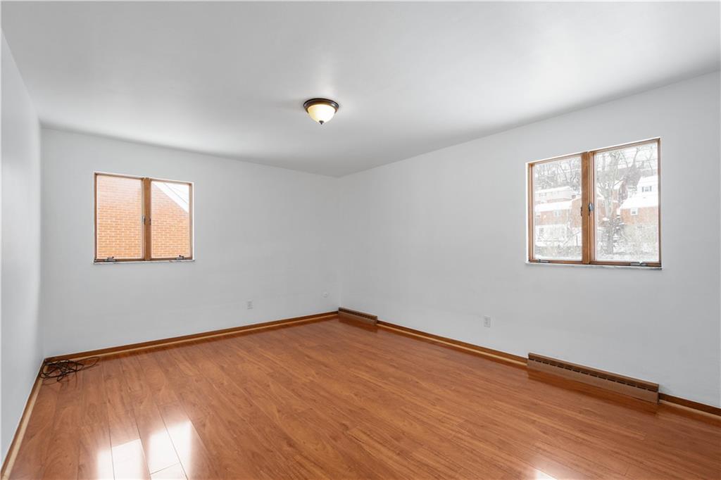 3930 Edge Road Pittsburgh, PA 15227 - Photo 23 of 45 a view of an empty room with wooden floor and a window