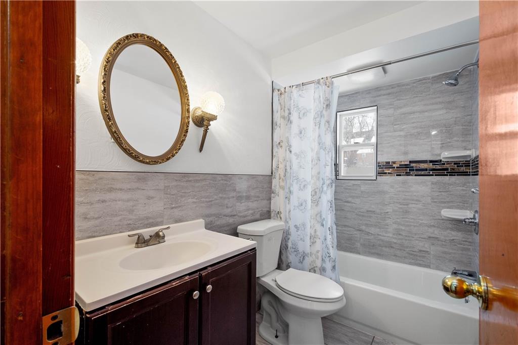 3930 Edge Road Pittsburgh, PA 15227 - Photo 29 of 45 a bathroom with a sink a toilet and a mirror
