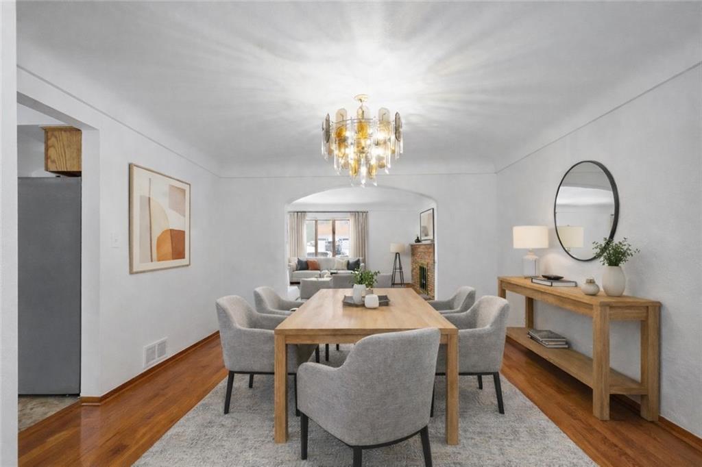3930 Edge Road Pittsburgh, PA 15227 - Photo 10 of 45 a view of a dining room with furniture a chandelier and wooden floor
