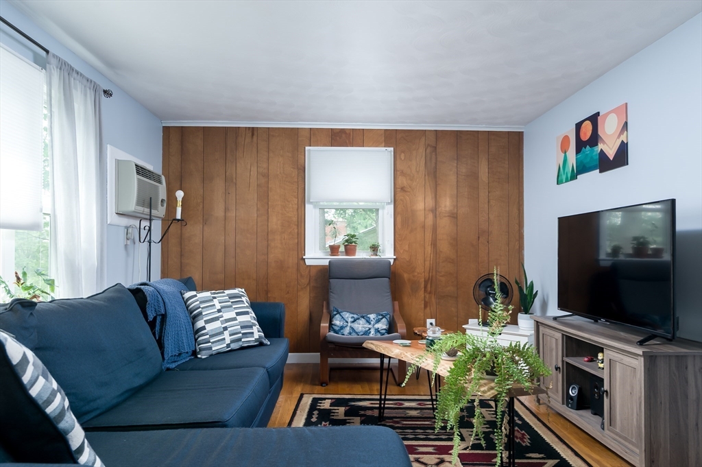 19 Maplewood Road Worcester, MA 01602 - Photo 8 of 23 a living room with furniture and a flat screen tv