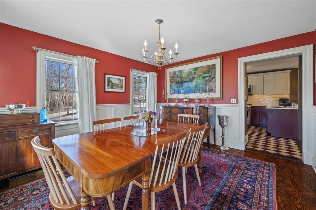 9 River Road Topsfield, MA 01983 - Photo 17 of 42 a dining room with furniture a window and a chandelier