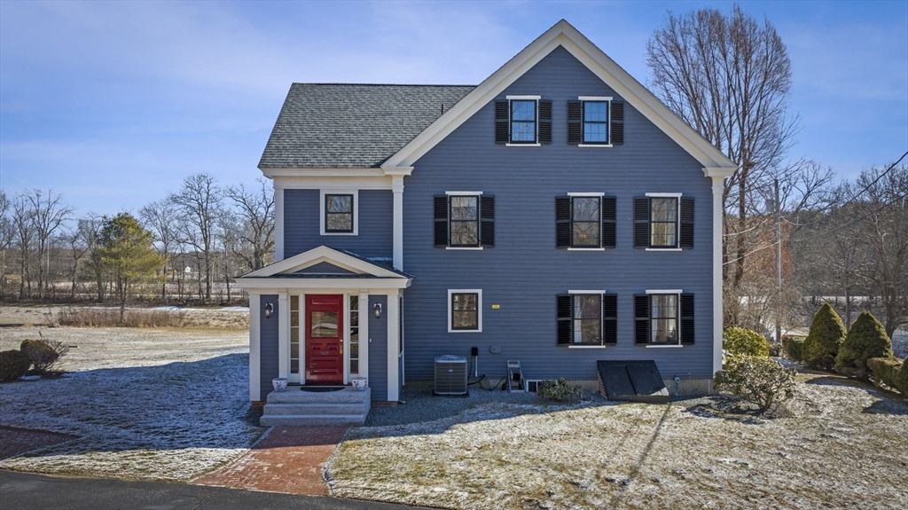 9 River Road Topsfield, MA 01983 - Photo 2 of 42 a front view of a house with garden