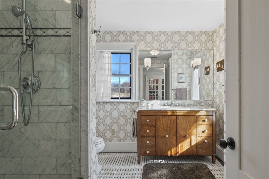9 River Road Topsfield, MA 01983 - Photo 27 of 42 a bathroom with a bathtub and shower