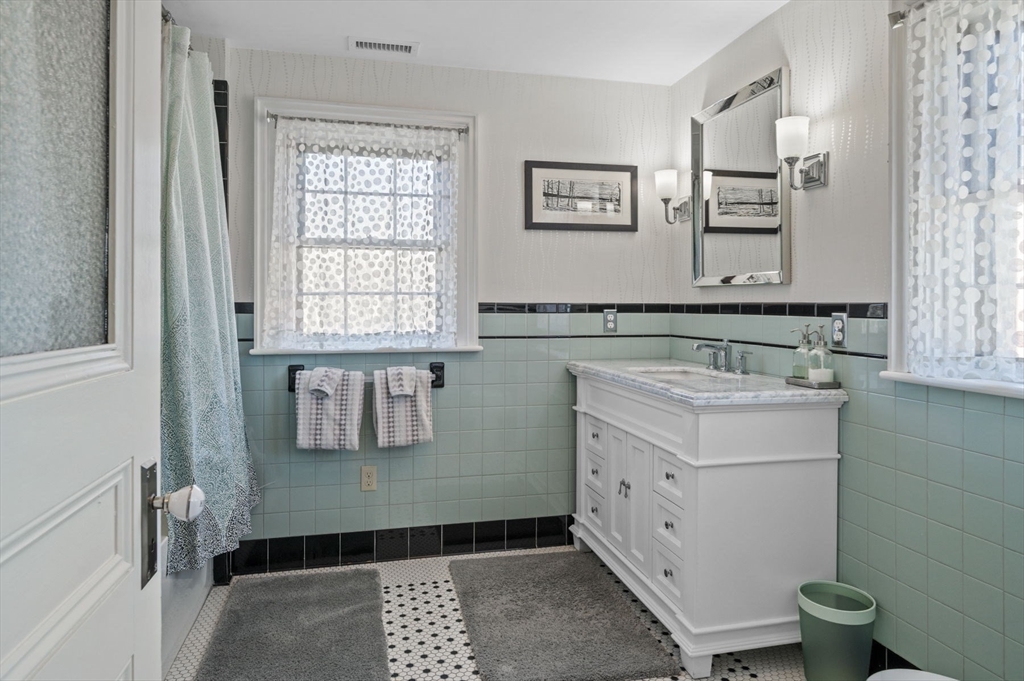 9 River Road Topsfield, MA 01983 - Photo 34 of 42 a bathroom with a sink and a mirror