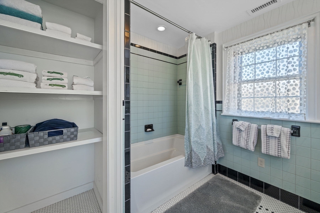 9 River Road Topsfield, MA 01983 - Photo 36 of 42 a bathroom with a bathtub and a shower
