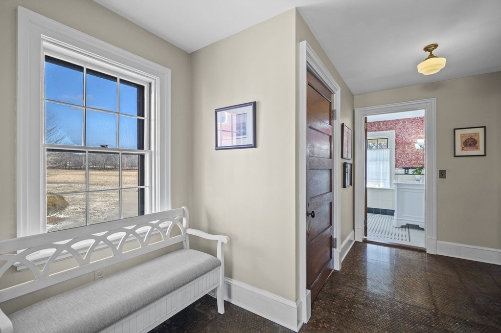 9 River Road Topsfield, MA 01983 - Photo 6 of 42 a spacious bedroom with a bed and a window