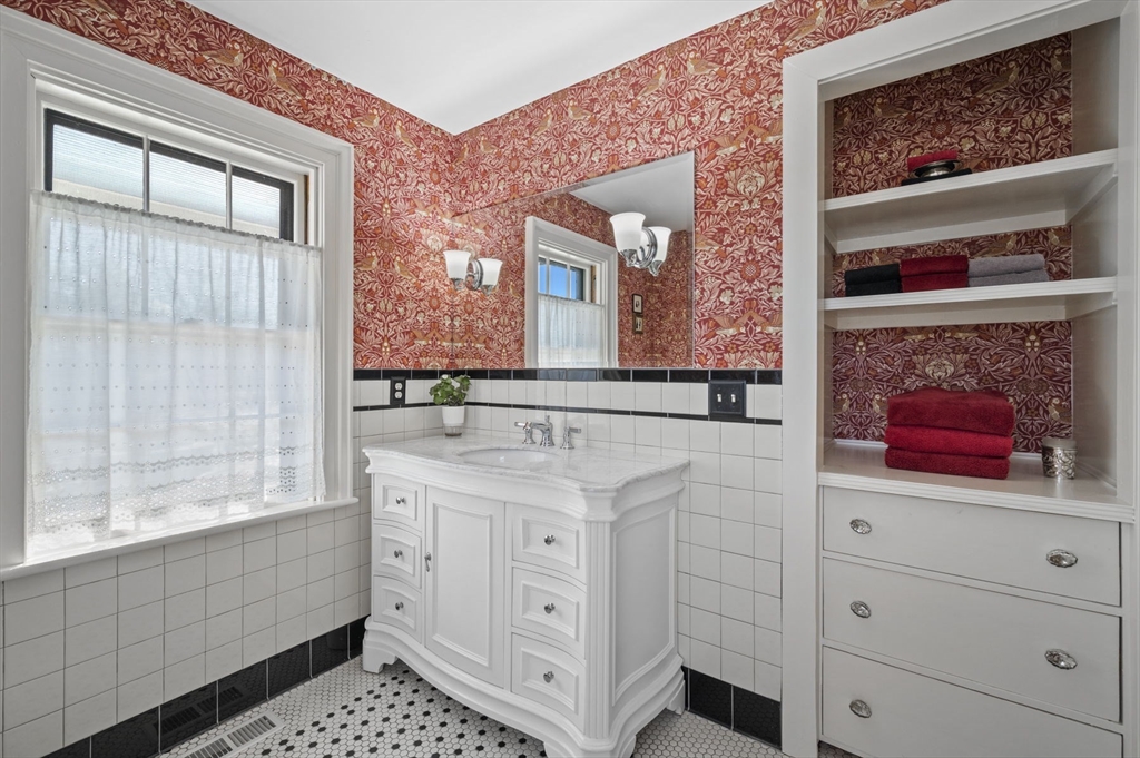 9 River Road Topsfield, MA 01983 - Photo 10 of 42 a bathroom with a sink a vanity and a large mirror