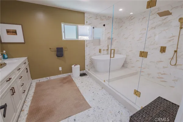 a bedroom with a large bed and a large window