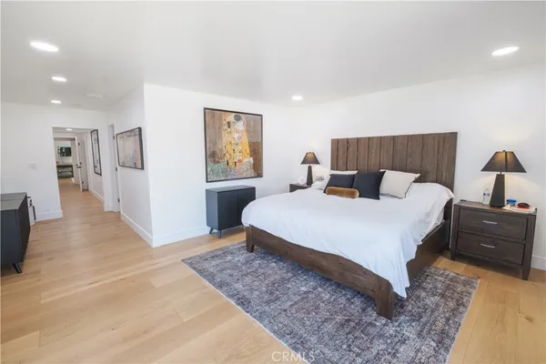 a view of walk in closet with clothes