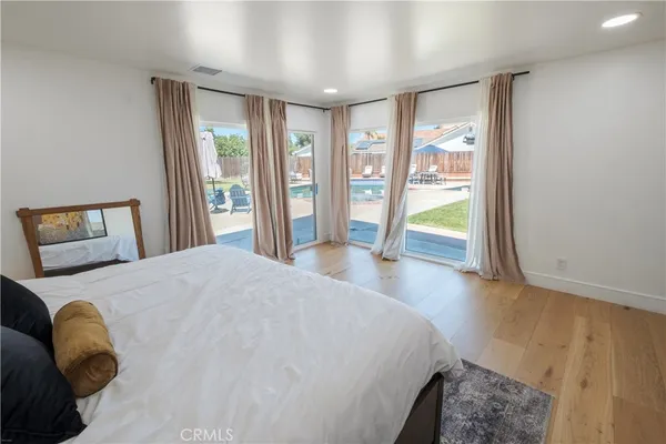 a view of walk in closet with clothes